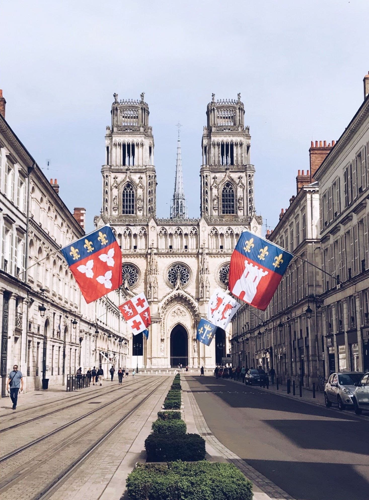 Orléans Cathedral at the end of a street hung with flags
